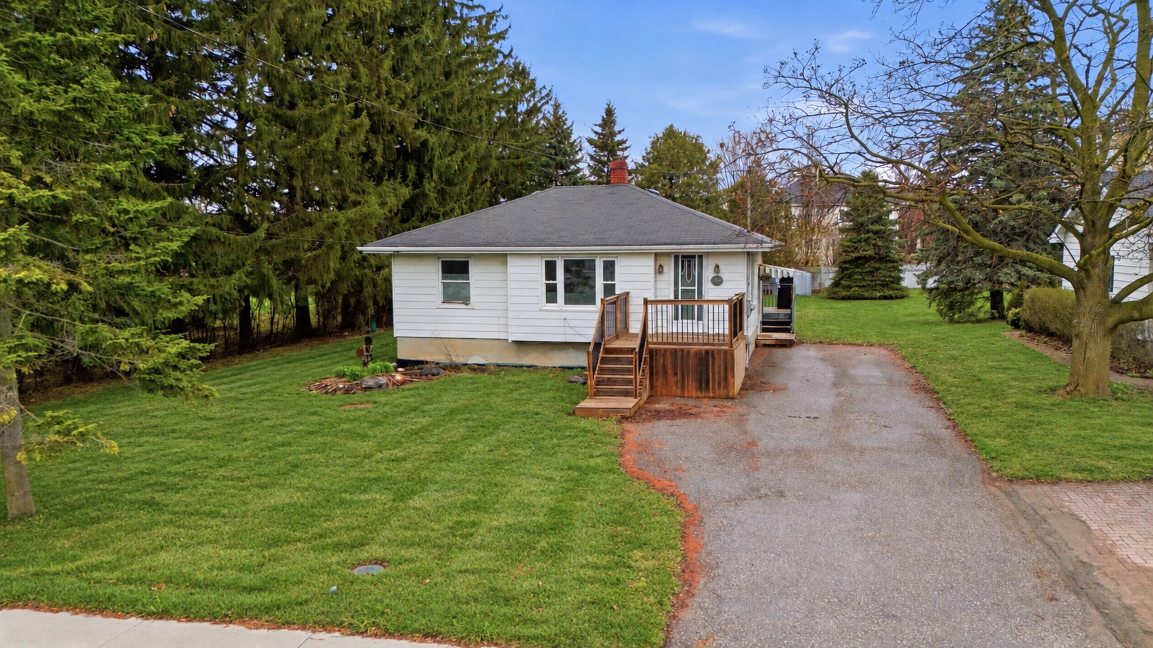 Exterior of 148 Winchester Road East with lawn and porch