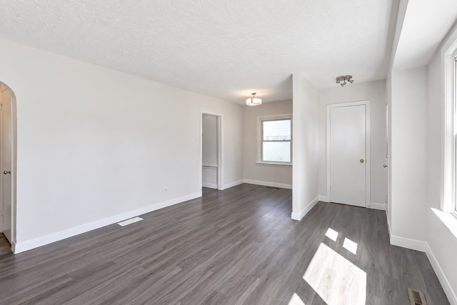 Reverse view showing connections between the living area, dining area and entry